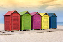 Colorful Beach Huts On Sandy Beach
