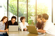 © livertoon - Asian Team group freelancer are brainstorming and meeting at coffee shop cafe. Feeling funny and happy.