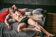 © evgeniykleymenov - studio portrait young sexy men bodybuilder athlete, with a bare torso, lies on a bed in pillows in underwear