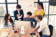 © livertoon - Multiethnic asian business group in casual suit meeting and discuss about their project and looking presentation on computer desktop in modern office. Business and Technology concept
