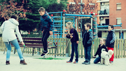 Wall Mural - Children playing skipping rope