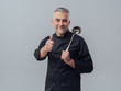 © stokkete - Chef posing with a spoon ladle