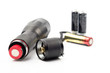 black flashlight opening the tail cap and have red alkaline battery inside on white background