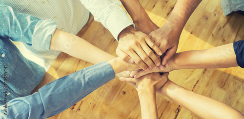 Fotomural Teamwork concept,Business team standing hands together in the loft office