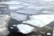 Landscape With Melt Broken Ice Floes Floating On The River On A Spring Day Close Up