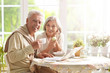 © aletia2011 - Beautiful elderly couple having breakfast