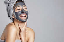 Laughing Woman Having Fun With Facial Mask On