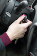 © yanik88 - Closeup inside vehicle of hand holding key in ignition, start engine key