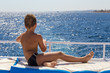 © Sergiy Bykhunenko - Tanned boy looking to the blue sea from yacht board