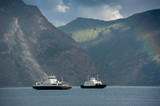 Fototapeta  - Two ferries at norwegian fjord