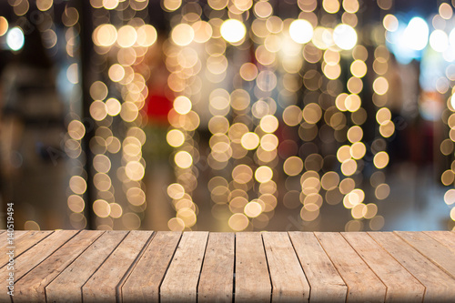 Fotografie, Obraz Warm bokeh blurred background on wooden table