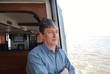 © st_fox - A man travels by sea on a ship