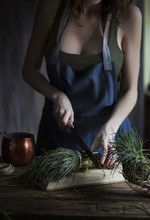 Woman Cutting Agretti, A Typical Italian Spring Vegetables