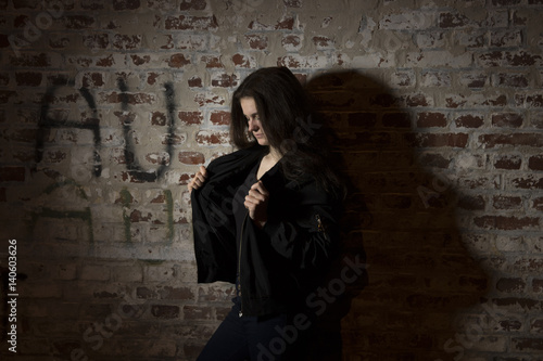 Photo  tough girl in front of Graffiti Wall