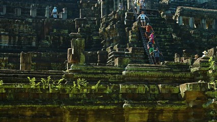 Wall Mural - Tourists Clamber down the Steep Stairs of Baphuon Temple, Cambodia, Angkor