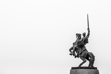 Statue of King Svatopluk in front of Bratislava Castle in black and white