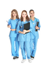 Canvas Print - Young attractive doctors on white background