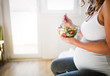 © NDABCREATIVITY - Beautiful pregnant woman eating healthy food
