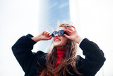 Fototapeta Młodzieżowe - Fashion portrait of young elegant confident woman outdoor. black jacket, red lips and sunglasses.