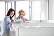 © MDBPIXS - Businesswomen discussing in creative office