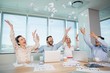 © WavebreakMediaMicro - Happy business executives throwing crumpled paper in air