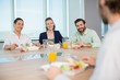 © WavebreakMediaMicro - Smiling business executives having meal in office
