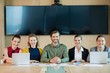 © WavebreakMediaMicro - Smiling business team sitting in conference room