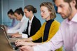 © WavebreakMediaMicro - Business executives using electronic devices on conference table