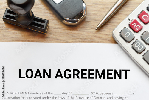 Top View Of Loan Agreement Lay Down On Wooden Desk With Rubber Stamp And Calculator Stock Photo Adobe Stock