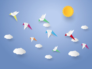 Wall Mural - Flock of birds flying in the sky , paper art style