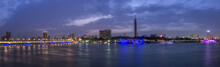 Panoramic View Of Cairo City Center At Twilight, The Kasr El Nile Bridge And The Island Of Zamalek With Its Colorful Boats On The Nile River.