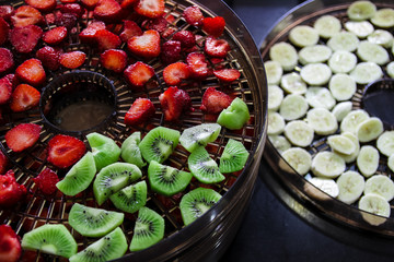 Dried fruits in a dryer, kiwi, banana, strawberry