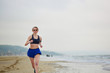 © Ekaterina Pokrovsky - Young fitness running woman jogging on beach