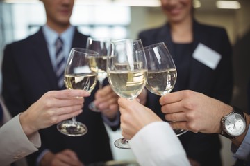 Businesspeople toasting glasses of champagne