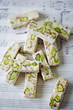 Soft cubes of white nougat with pistachios