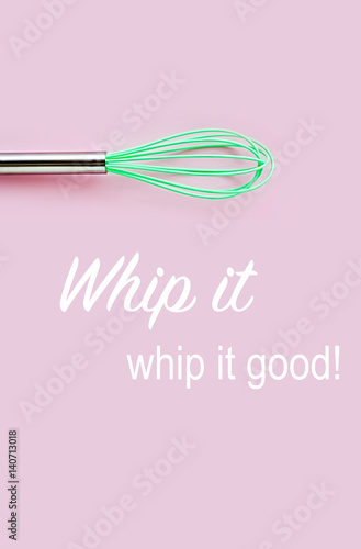 Neon green culinary whisk top view on pastel color background Poster