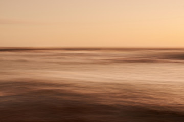 Wall Mural - smooth blurred sunset at sea background