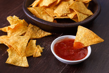 Nachos Chips. Delicious Salty Tortilla With Sweet Salsa Or Chilli Sauce On Wooden Background. Snack On Rustic Plate.