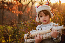 Boy Carrying Firewood