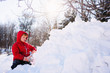 © RooM The Agency - Little boy building a snowfort