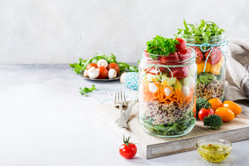 Wall Mural - Homemade salad in glass jar with quinoa and vegetables. Healthy food, diet, detox, clean eating and vegetarian concept with copy space.