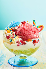 Wall Mural - Children's ice cream sundae with sweets in glass