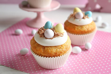 Wall Mural - Delicious Easter cupcakes on white table