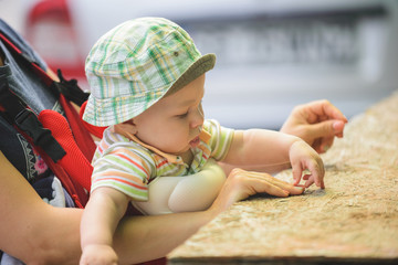 Wall Mural - Boy Touching Mother's Finger