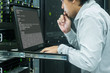 © Pixza - System administrator serious working in data center