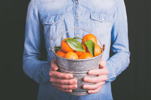 Tangerines Bucket In Hands - Vegetarian And Vegan People  - Filter Vintage Style
