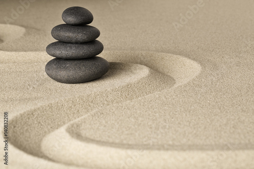 Naklejka - mata magnetyczna na lodówkę Zen stone balance and harmony, a pile of dark black stones stacked in a Japanese sand garden.