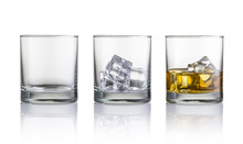 Empty Glass, Glass With Ice Cubes And Glass With Whiskey And Ice Cubes. Isolated On White Background