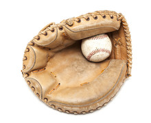 An Old Leather Catchers Mit And Hardball On A White Background.