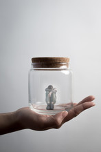 Man Sit In Jar